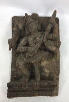 An Indian carved wooden figures of a deity.