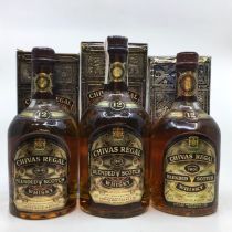 Whisky. 2x 75cl Bottles of Chivas Regal 12 Year Old Blended Scotch Whisky and 1x 1itre of same. (3).