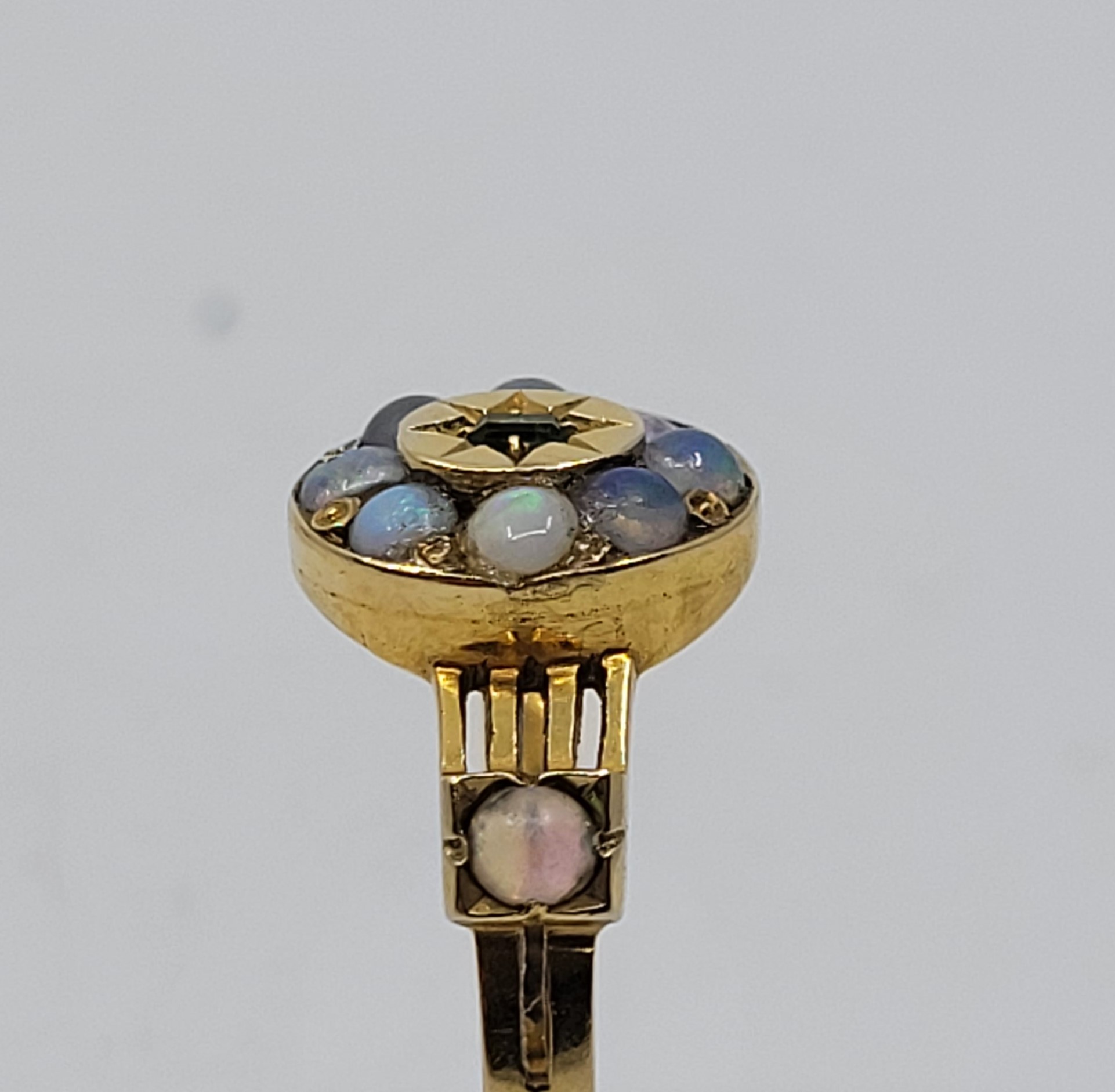 An 18ct gold, emerald and opal ring, the oval mount with raised centre illusion set single - Image 3 of 4