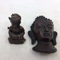 An Asian carved wooden figure of Buddha (H:15cm) together with a small Chinese figure (H:7.5cm) (2)