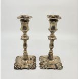 A pair of Victorian silver candlesticks, by Henry Wilkinson & Co, London 1893, with weighted