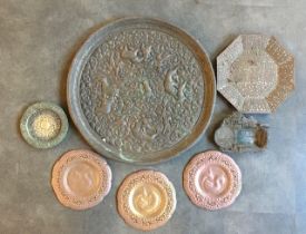 A collection of brass/bronze plates to include an Indian bronze plate (7)