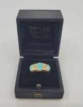 An 18ct. gold, opal and diamond ring, Birmingham 1912, set three graduated oval cabochon opals