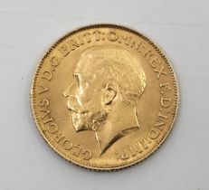 A George V 1912 gold sovereign coin, London mint.