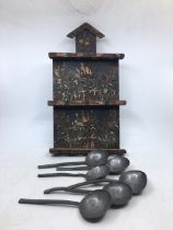 A 18th century wall hanging spoon holder with spewter period spoons