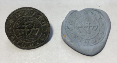 Incomplete medieval copper seal matrix with most of the hexagonally faceted handle missing.