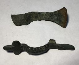 Mixed lot containing the broken lower half of a copper alloy Saxon cruciform brooch. 8.64g.