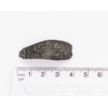 Highly decorative Saxon copper alloy strap end. A large example with convex sides tampering to a