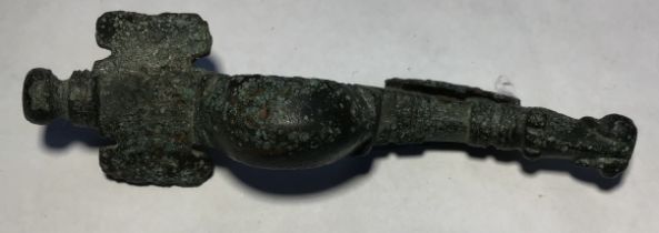Late 5th-6th century cast copper alloy zoomorphic cruciform brooch with the iron pin missing on