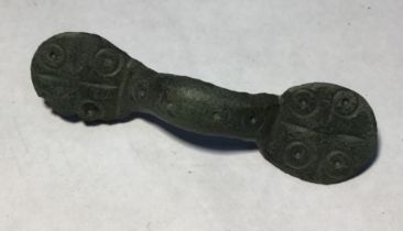 Saxon equal arm brooche. Circa 8th-10th century AD. Copper alloy brooch formed  of a central arch