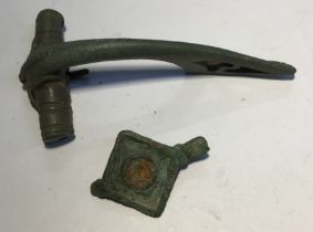 ***No Lot*** 2nd to 3rd century copper alloy Roman lozenge plate brooch. Pin missing. Centre