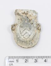 Medieval Pilgrims Ampulla 14/15th century AD. One side is decorated with a 3 chevron shield and