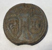 A complete lead 'papal bulla' of Pope Alexander IV (1254-1261). The obverse depicts the busts of