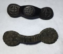 A pair of Saxon equal arm brooches. Circa 8th-10th century AD. Copper alloy brooch formed  of a