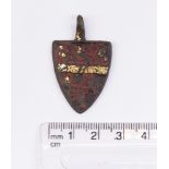 "Medieval Heraldic Mount. Copper-alloy. H30mm. W24mm. 10.37g. The pendant has a red enamel