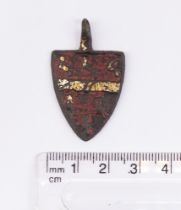 "Medieval Heraldic Mount. Copper-alloy. H30mm. W24mm. 10.37g. The pendant has a red enamel