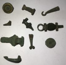 Collection of Roman to Post Medieval metal Items. Includes brooches and a foot from a bronze deity.