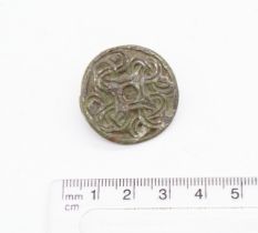 Viking copper alloy disc brooch with some silvering remaining. Decorated with highly intricate Borre