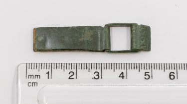 Late Medieval complete working copper alloy strap clasp with the leather remaining between the