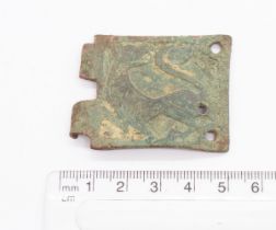 Large incomplete rectangular copper alloy buckle plate. Image is of a lion passant regardant and the