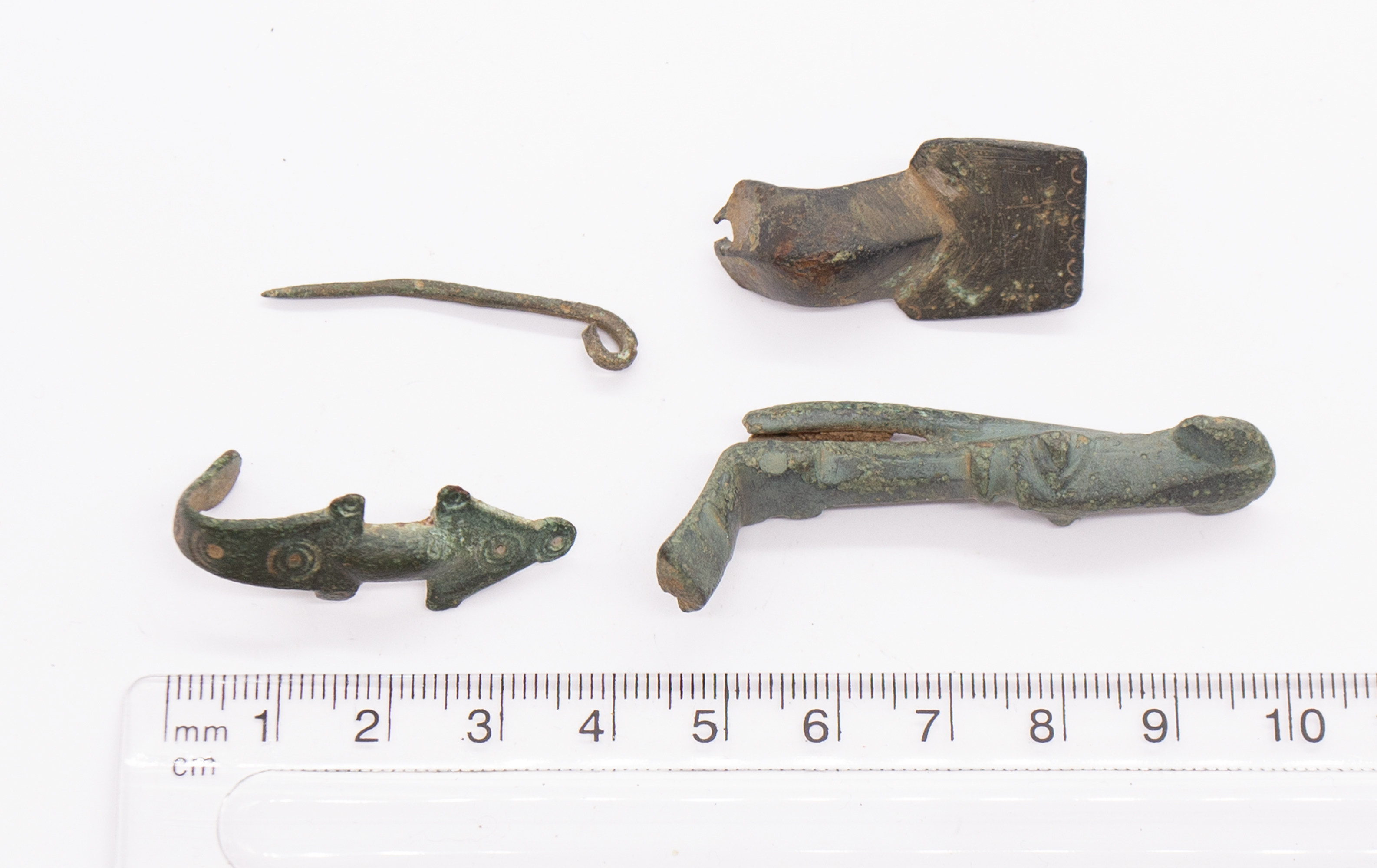 Saxon copper alloy Brooch group. Circa 6th-8th century. Selection containing a broken equal arm