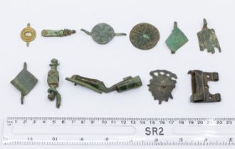 Mixed lot of incomplete medieval copper alloy artefacts including a section of a slide key