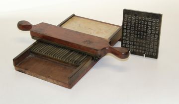 A 19th century chemist's mahogany, brass and marble pill roller/ cutter, together with a bronze