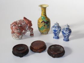 A group of oriental porcelain items, to include a Chinese yellow ground baluster vase, a pair of