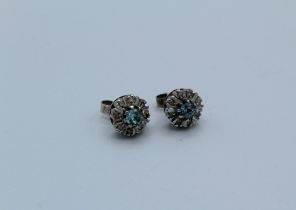 A pair of 18ct white gold blue zircon and diamond cluster ear studs