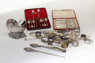 A collection of silver items, comprising a cased set of silver handled butter knives, a cased set of