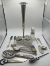 A collection of sterling silver and other decorative items. Comprising a Lund Silver weighted posy
