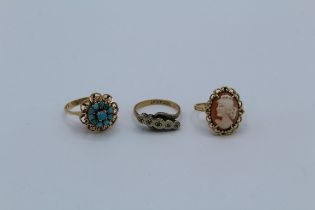 A collection of three dress rings featuring a diamond set ring 18ct and Plat, a shell cameo ring,