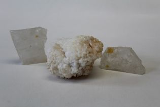 A grouping of calcite specimens featuring two included optical calcite slabs, approximate length