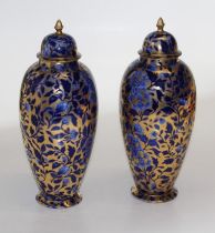 A pair of 19th century Staffordshire porcelain Chinoiserie decorated blue and gilt baluster form