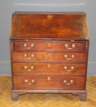 A George III mahogany bureau, with fitted fall over four graduated long drawers, on bracket feet,