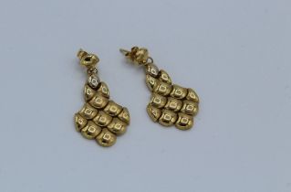 A pair of Italian ''750'' pebble pattern earrings, approximate weight 9gm