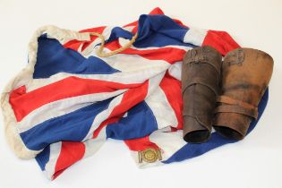 Early 20th century military items: A naval Union Flag, a naval buckle and a pair of Stohwasser