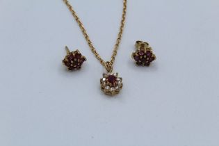 A pair of ruby earrings in 9ct gold together with a diamond and ruby cluster pendant and chain.