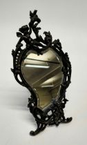 A 20th century bronze Rococo easel toilet mirror, cast with cherubs, after Paul LeCourtier, 40cm