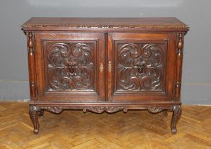 A 19th century Flemish, carved oak two door low dresser , raised on cabriole legs. 100 x 137 x 50cm