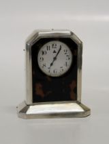 A small Edwardian tortoiseshell and silver mounted mantle timepiece. Hallmarks Birmingham 1925. 10cm