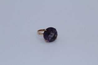A synthetic colour change sapphire cocktail ring in precious rose yellow metal. Bearing Egyptian