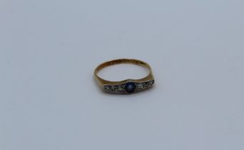 An Art Deco sapphire and diamond ring, size R, stamped 18ct to shank, 2.7gm approximately