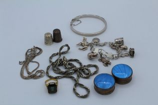 A collection of silver jewellery comprising a silver charm bracelet with eight charms, to include