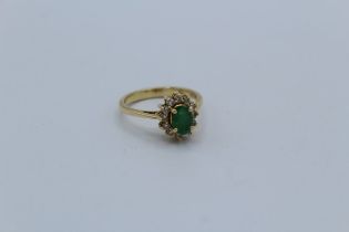 An 18ct yellow gold emerald and diamond cluster ring, size L, gross weight approximately 4gm