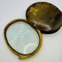 Horn magnifying glass. Approximately 3.5 inches across. Some damage - see photographs for details.