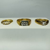 Three gold and diamond rings. Comprising a gentleman's 9ct gold ring, set with six round brilliant