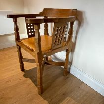 Robert "Mouseman" Thompson carved oak armchair with leather seat with studded edge. Approximately