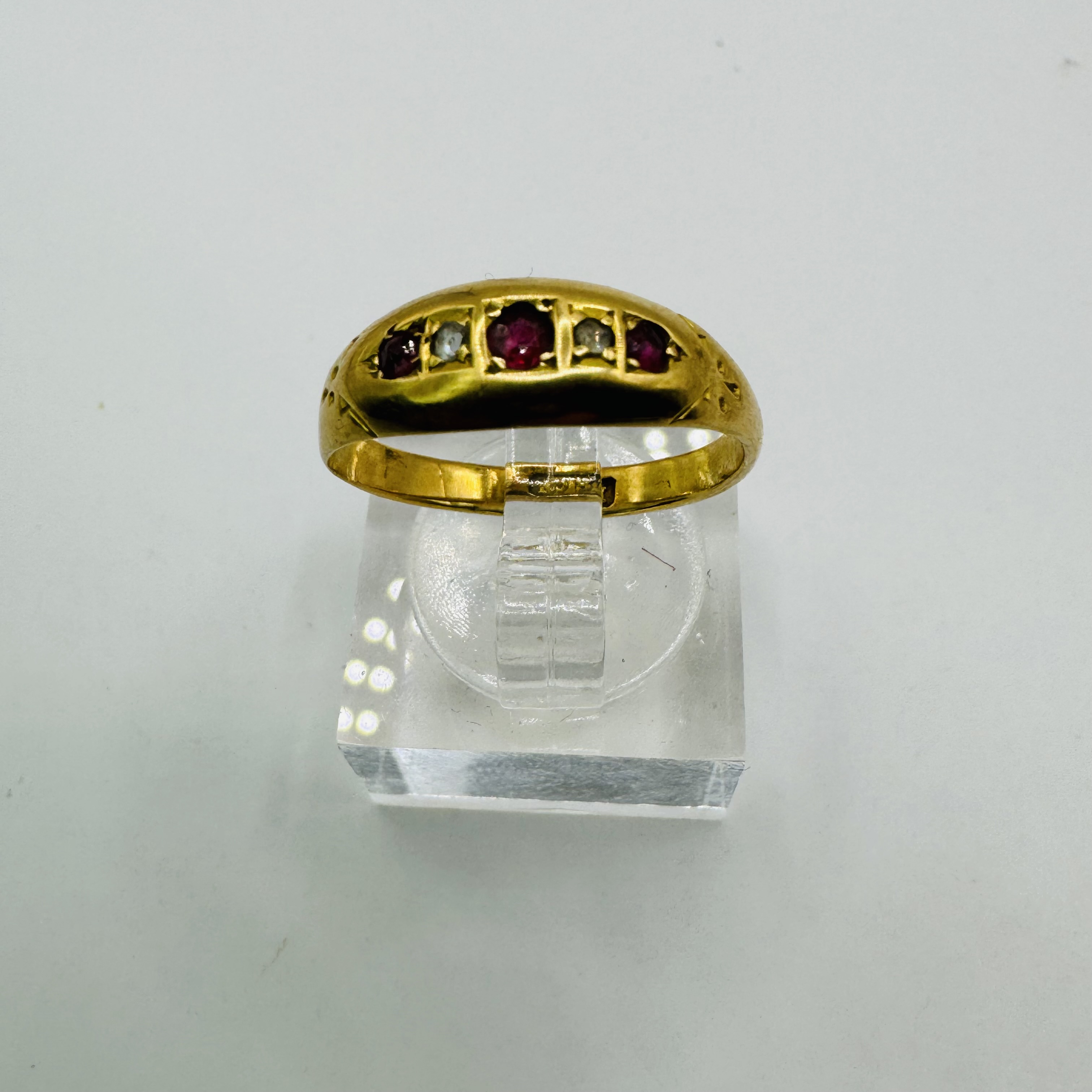 Two 18ct yellow gold gem set half hoop rings, along with an "18ct" stamped ruby and diamond ring and - Image 3 of 5