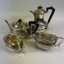 A four-piece George V tea set. Comprising tea pot, hot waterpot, milk jug and sugar bowl. Pots with